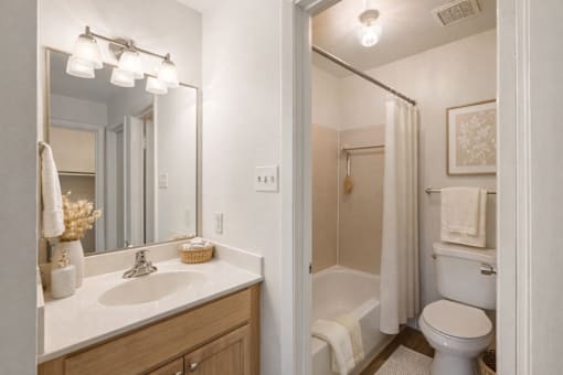 A bathroom with a white toilet and a white sink.