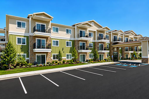 Exterior building and parking lot at The Ellison Apartments, Layton, 84041