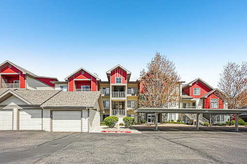 A row of houses with a clear blue sky above them.