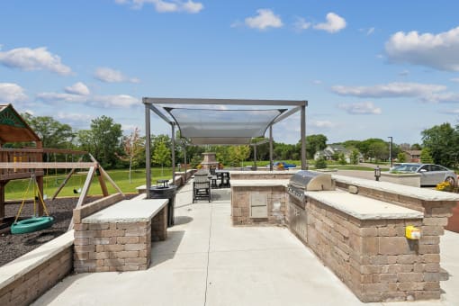a picnic area with benches and awnings at a park