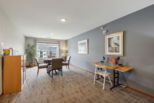 an open living room and dining room with a table and chairs