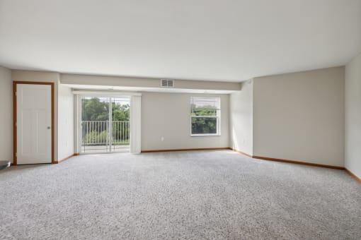 an empty room with three boxes on the floor