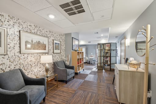 a lobby with chairs and a reception desk