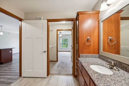 a bathroom with a sink and a mirror