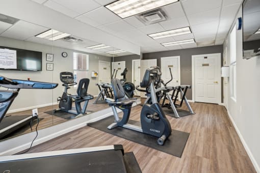 a gym with cardio equipment and exercise machines