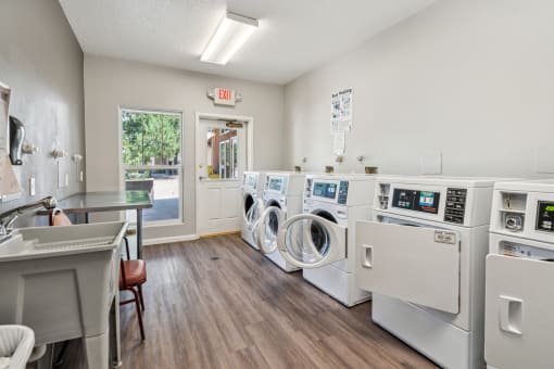 the preserve at ballantyne commons laundry room with washes and dryers