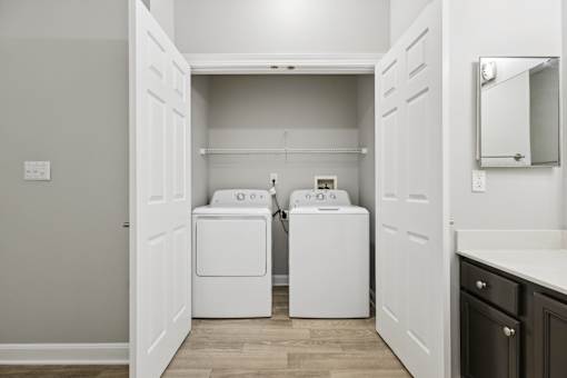 A laundry room with a washer and dryer in it.