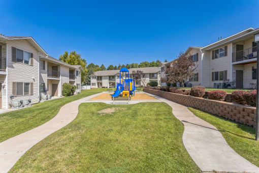 the preserve at ballantyne commons walkway with playground and apartment buildings