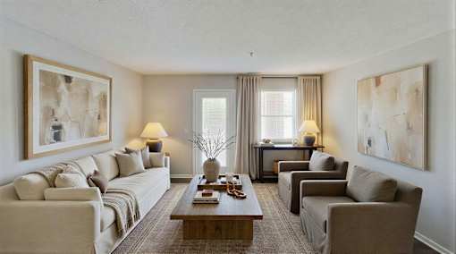 A living room with a couch, chairs, and a coffee table at Arbors at Hickory Creek Apartments , University Park, 60484