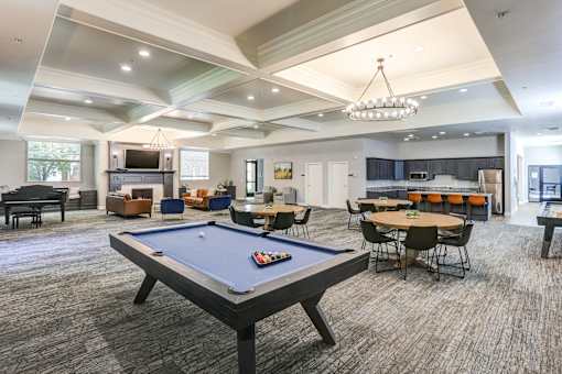 Resident clubhouse with pool table and seating at The Beckstead Apartments, South Jordan, 84095