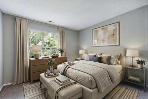 Bedroom with neutral tones and natural light at Delta Crossing Apartments, Charlotte, North Carolina