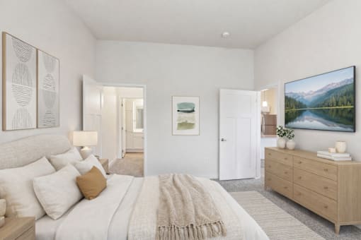 Bedroom with neutral tones and wood furnishings at Lake Ridge Apartments, Prior Lake