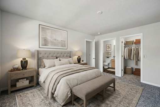 A bedroom with a large bed, a nightstand, and a TV on a wooden stand.