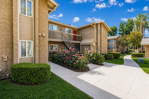 A sunny day at apartment complex with a clear blue sky.