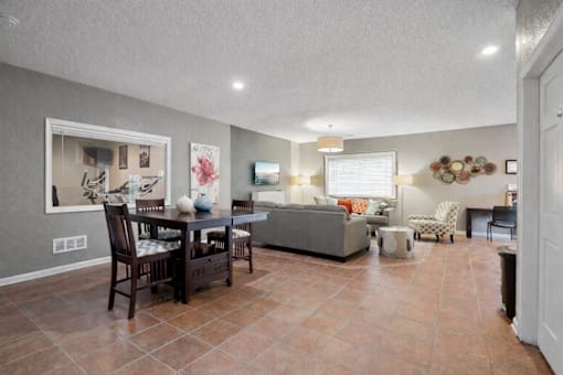 Open concept living and dining area with modern finishes at Carver Ridge Townhomes Apartments, Chaska, 55318