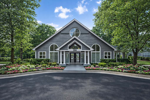 Clubhouse exterior with landscaped entrance at Delta Crossing Apartments, North Carolina, 28212