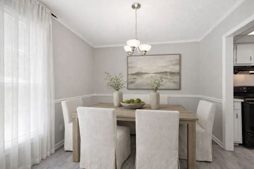 A dining room with a table set for two.