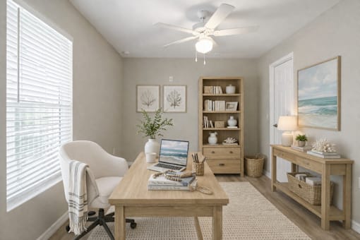 A room with a desk, chair, and shelves with decorative items.