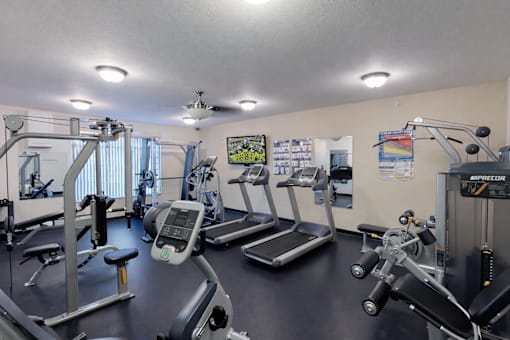 Fitness center with cardio and strength equipment at The Ponds at Heritage Place Apartments, Sartell, 56377