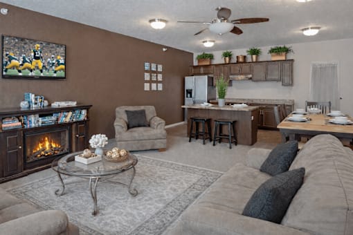 Open concept living room and kitchen area at The Ponds at Heritage Place Apartments, Sartell, Minnesota