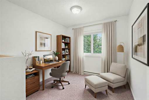Home office with wooden desk and bookshelf at Carver Ridge Townhomes Apartments, Minnesota