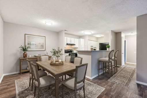 Open concept dining area with kitchen view at Delta Crossing Apartments, North Carolina, 28212