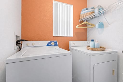 A laundry room with a washer and dryer.