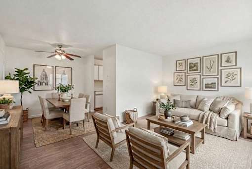 Open living and dining space with gallery wall at Carver Ridge Townhomes Apartments, Chaska, MN 55318
