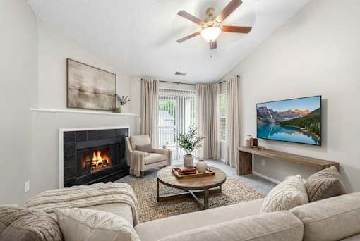 Living room with fireplace and vaulted ceiling at Delta Crossing Apartments, Charlotte, NC