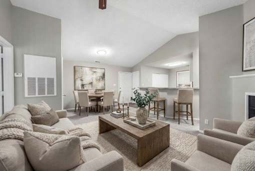 Open concept living and dining room with kitchen bar at Delta Crossing Apartments, Charlotte, 28212