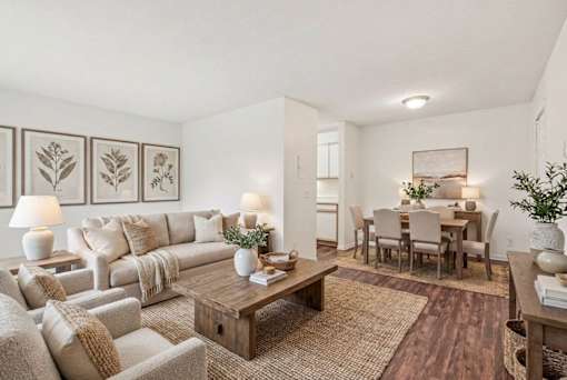 Living room and dining area with neutral decor at Carver Ridge Townhomes Apartments, Chaska, MN