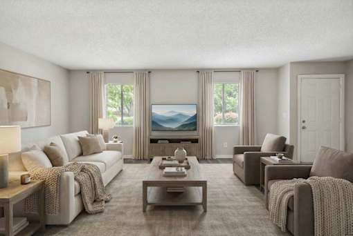 A living room with a large couch, a coffee table, and a television.