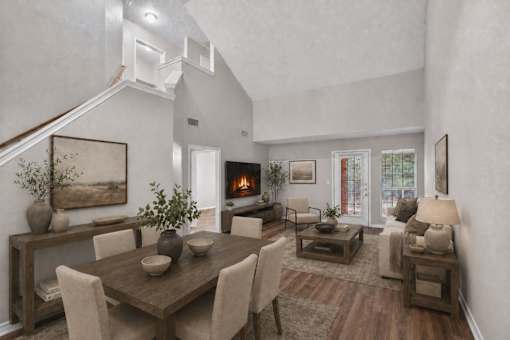 A modern dining room with a wooden table and chairs.