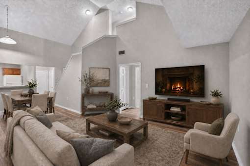 A cozy living room with a fireplace and comfortable seating.