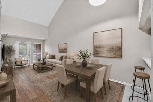 A dining room with a wooden table and chairs.