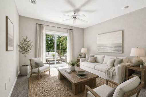 A living room with a couch, chair, and table.