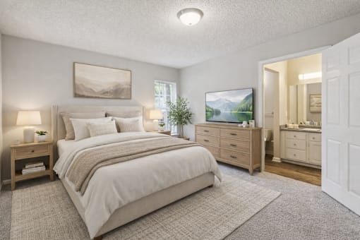 A bedroom with a large bed, a dresser, and a mirror.