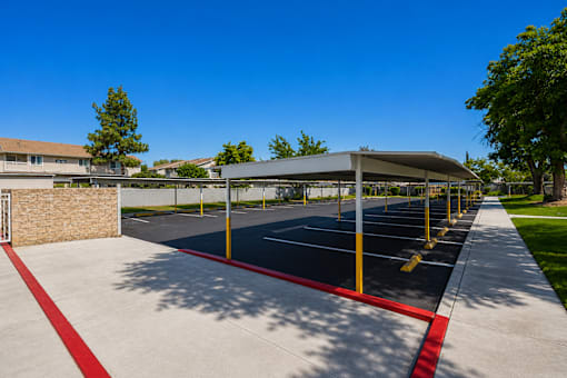 A parking lot with a red line painted on the ground.