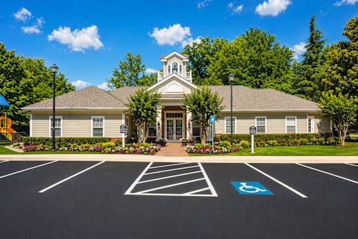 A church with a parking lot in front of it.