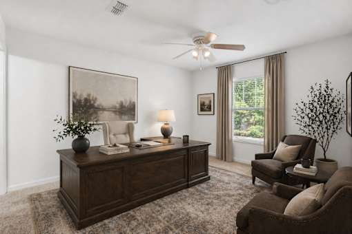 A room with a brown desk and a chair.