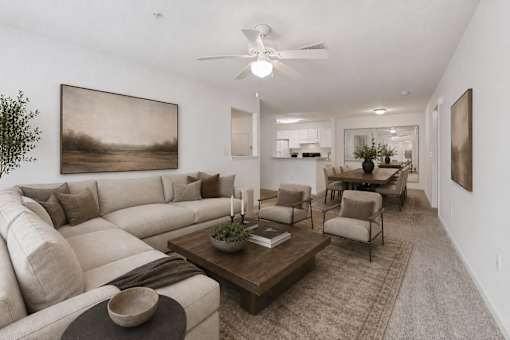 A living room with a large couch and a coffee table.