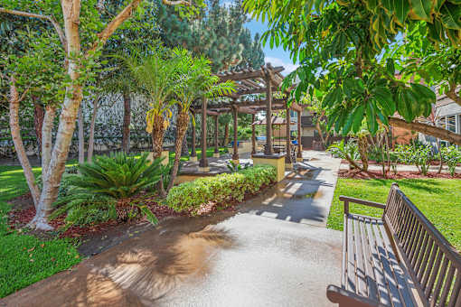 A park with a bench and a pathway.