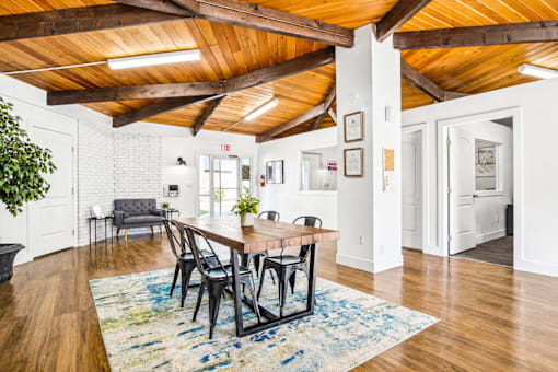 A dining room with a wooden table and chairs at The Morgan Apartments, Layton, UT, 84041