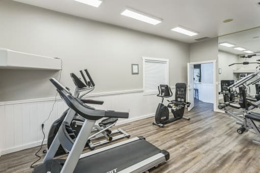 the gym with treadmills and ellipticals at the preserve at great neck apartments