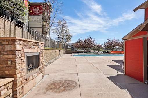 A red garage door is on the right side of the image.