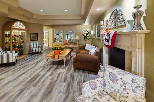 A living room with a fireplace and a couch.