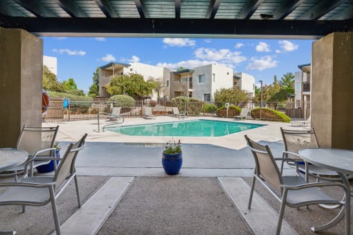 our apartments have a pool and patio with chairs and tables at Vista Linda, Santa Fe, NM 87507