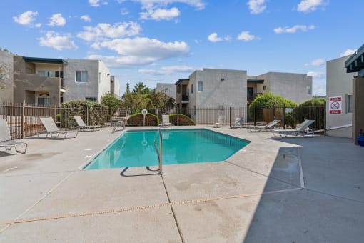 our apartments have a swimming pool and a patio with chairs at Vista Linda, New Mexico