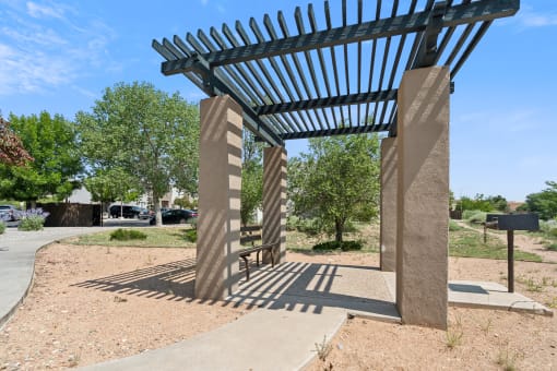 a shade structure on the side of a sidewalk at Vista Linda, Santa Fe