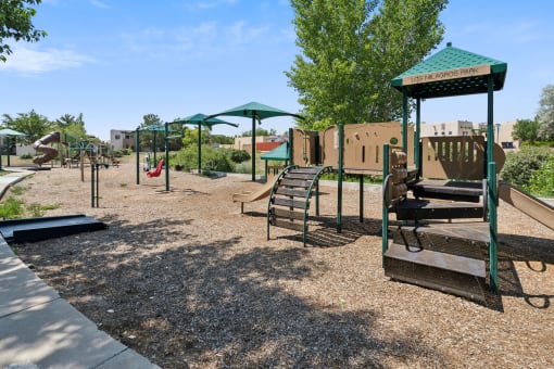 a playground with a swing set and other playground equipment at Vista Linda, New Mexico 87507